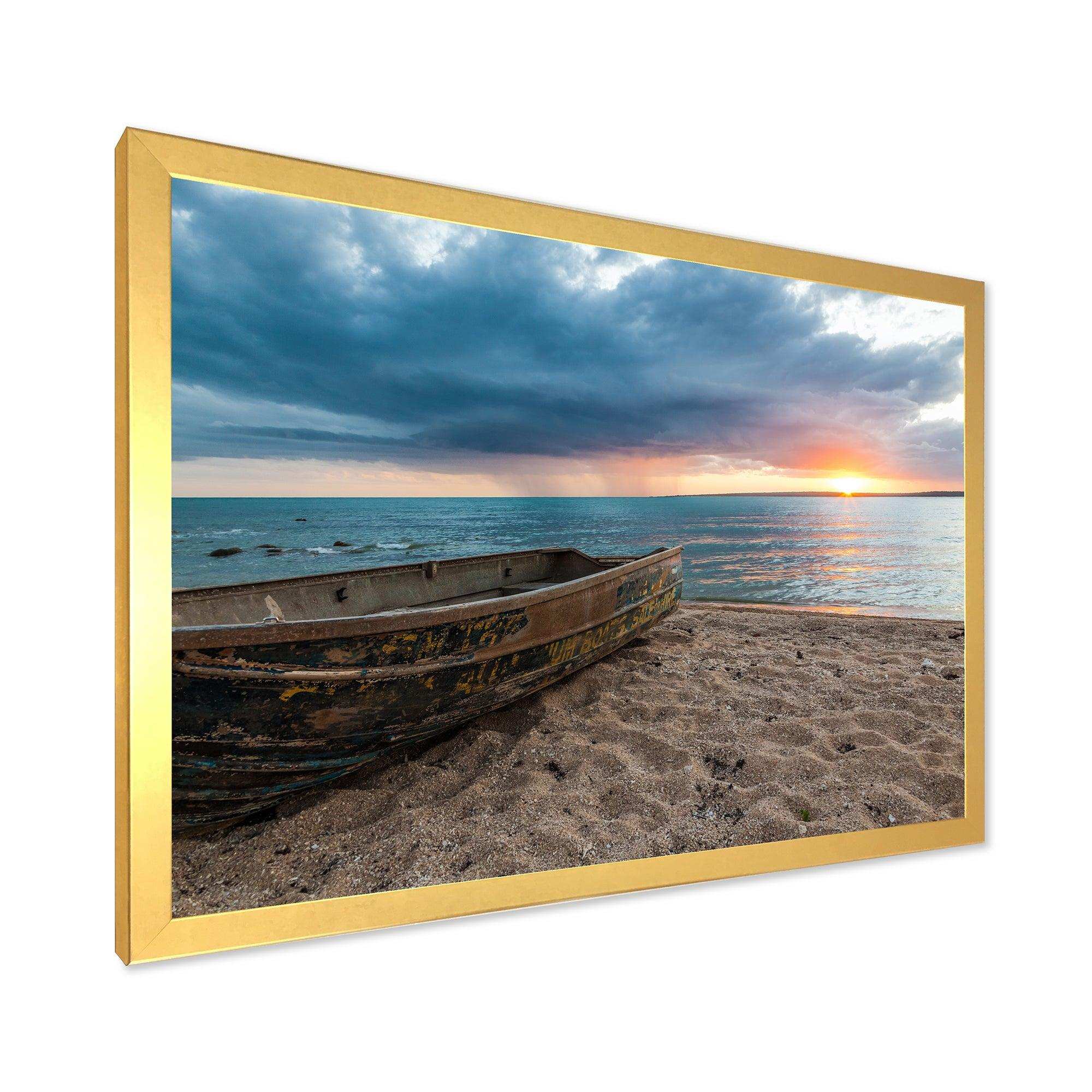 Rusty Row Boat on Sand at Sunset