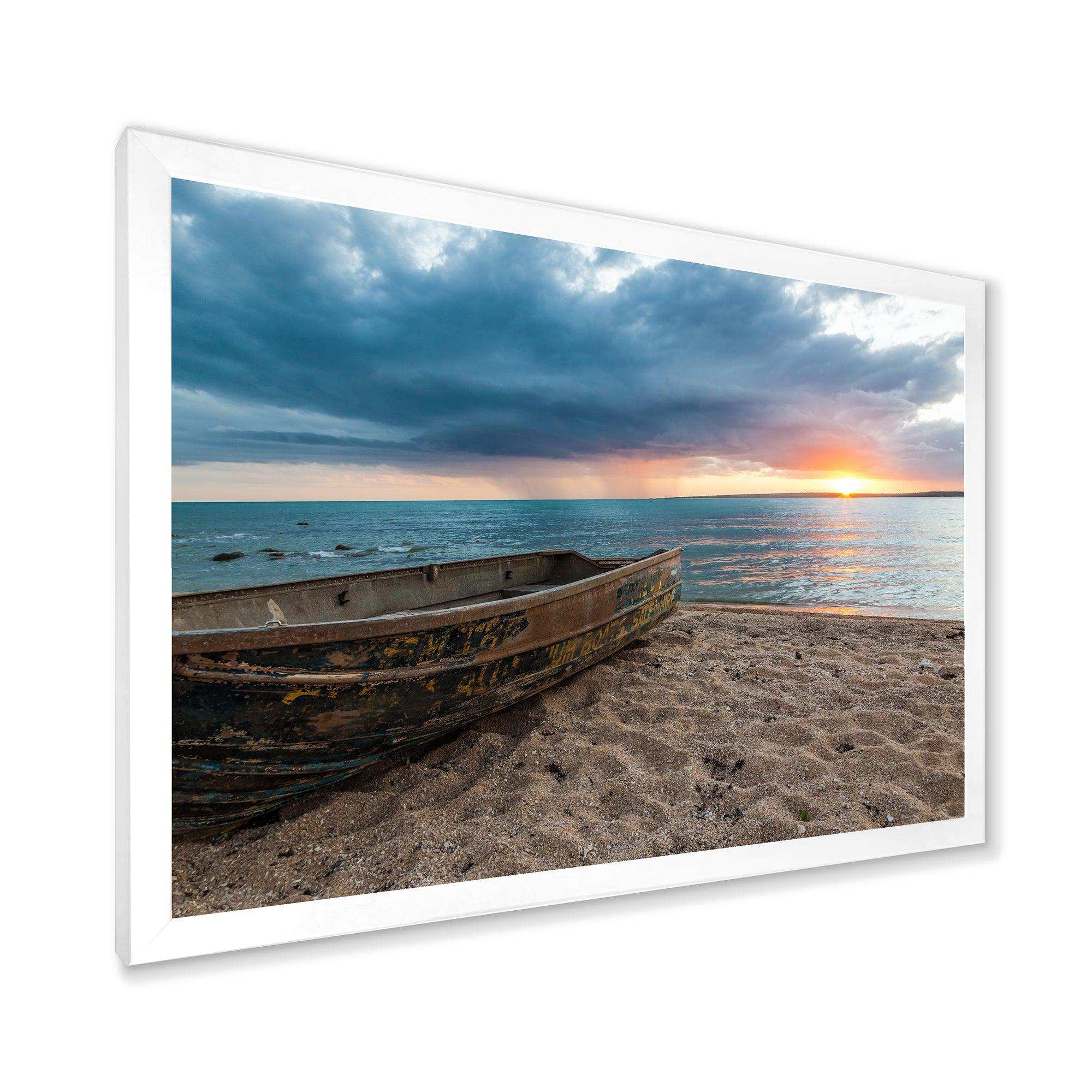 Rusty Row Boat on Sand at Sunset