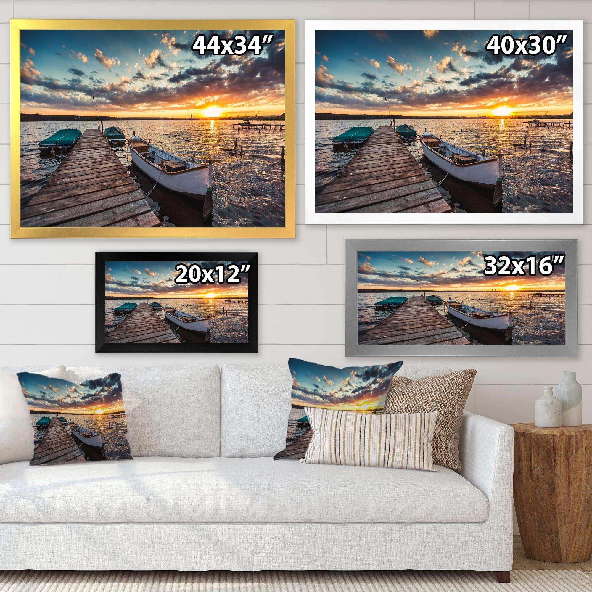 Boats and Jetty under Dramatic Sky