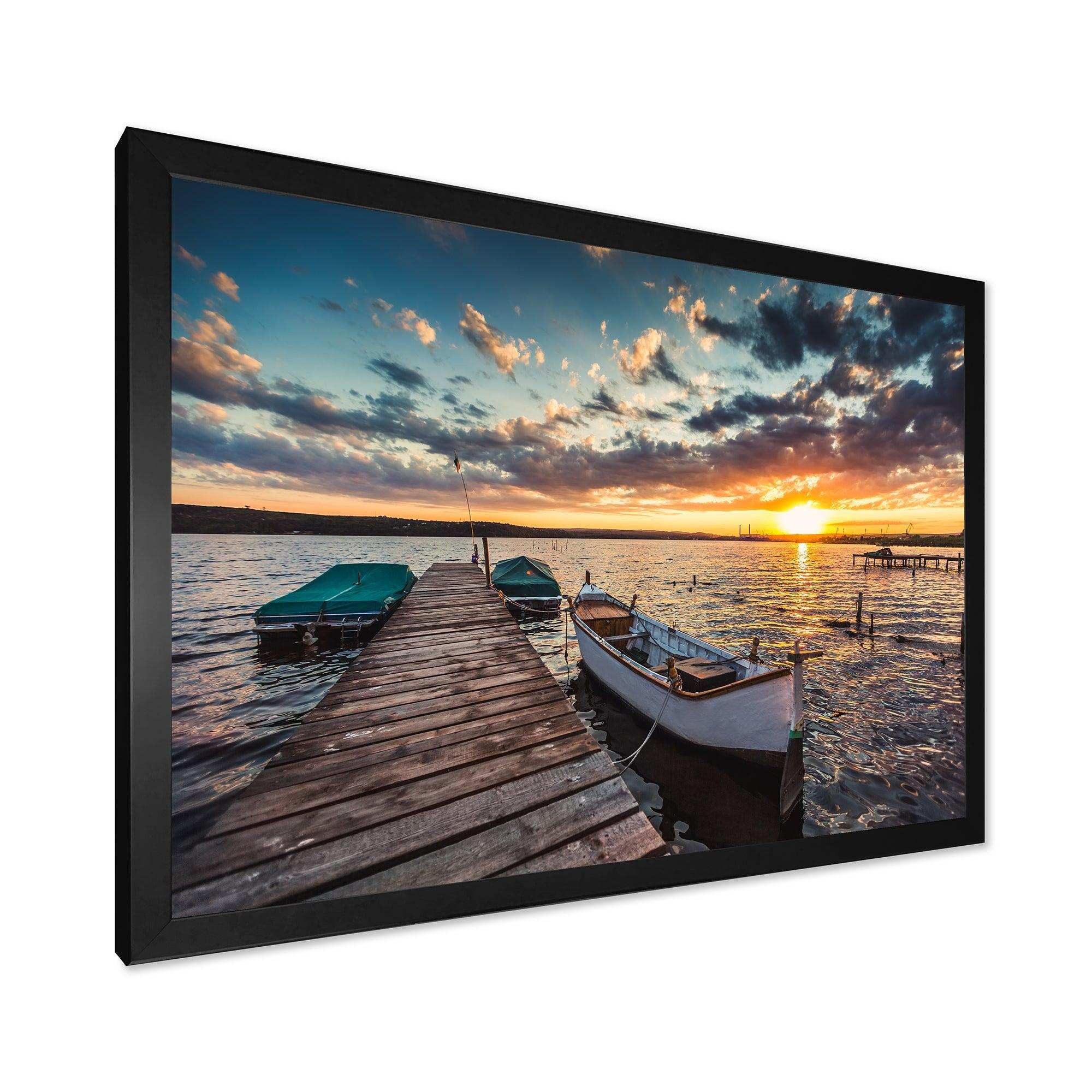 Boats and Jetty under Dramatic Sky
