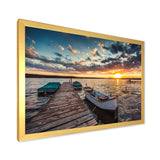 Boats and Jetty under Dramatic Sky