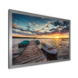 Boats and Jetty under Dramatic Sky