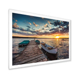 Boats and Jetty under Dramatic Sky