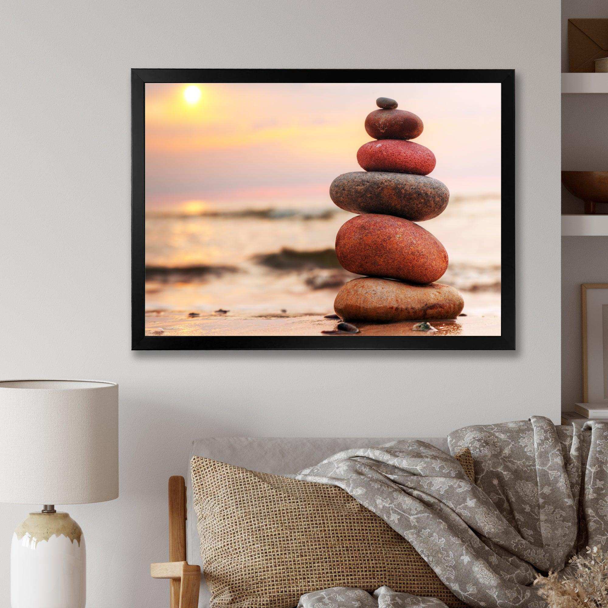 Stones Pyramid on Sand Symbolizing Zen