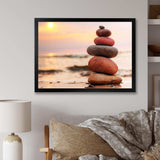 Stones Pyramid on Sand Symbolizing Zen