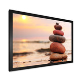 Stones Pyramid on Sand Symbolizing Zen