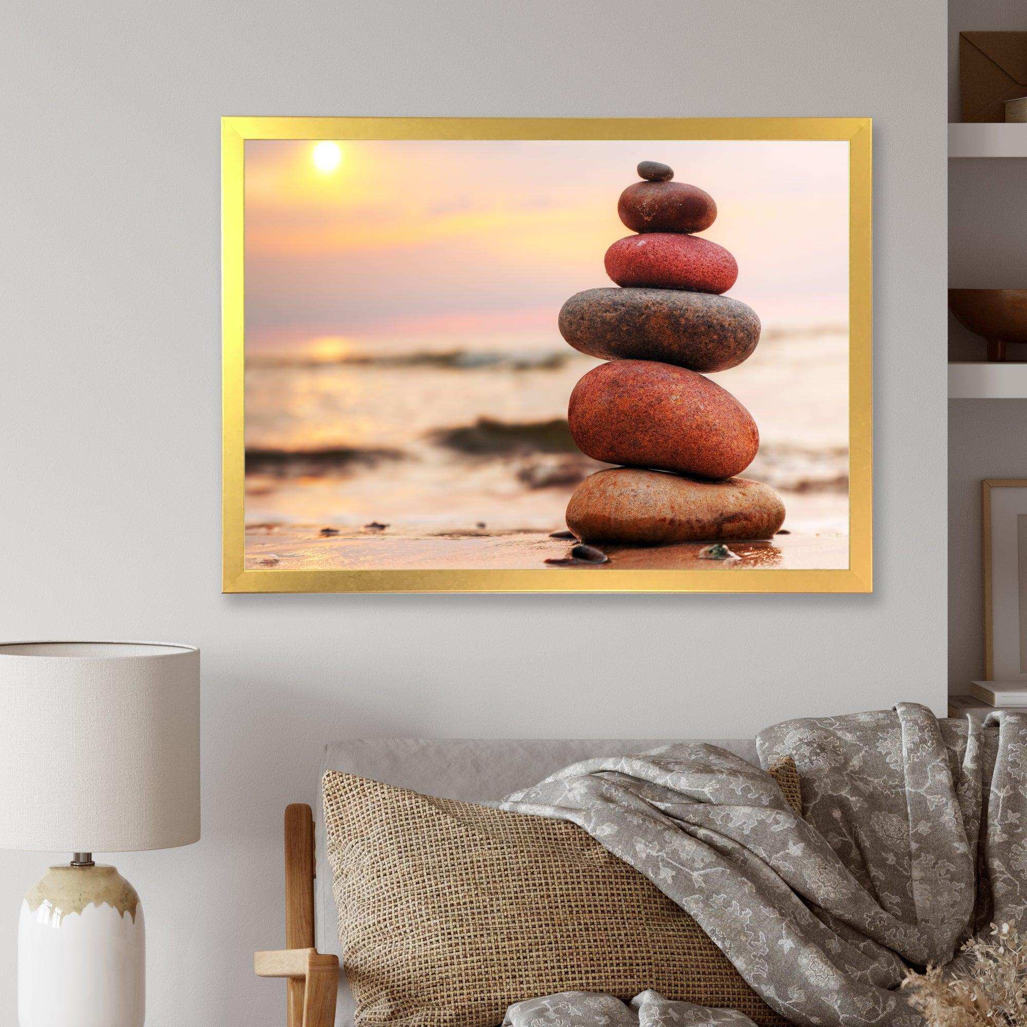 Stones Pyramid on Sand Symbolizing Zen