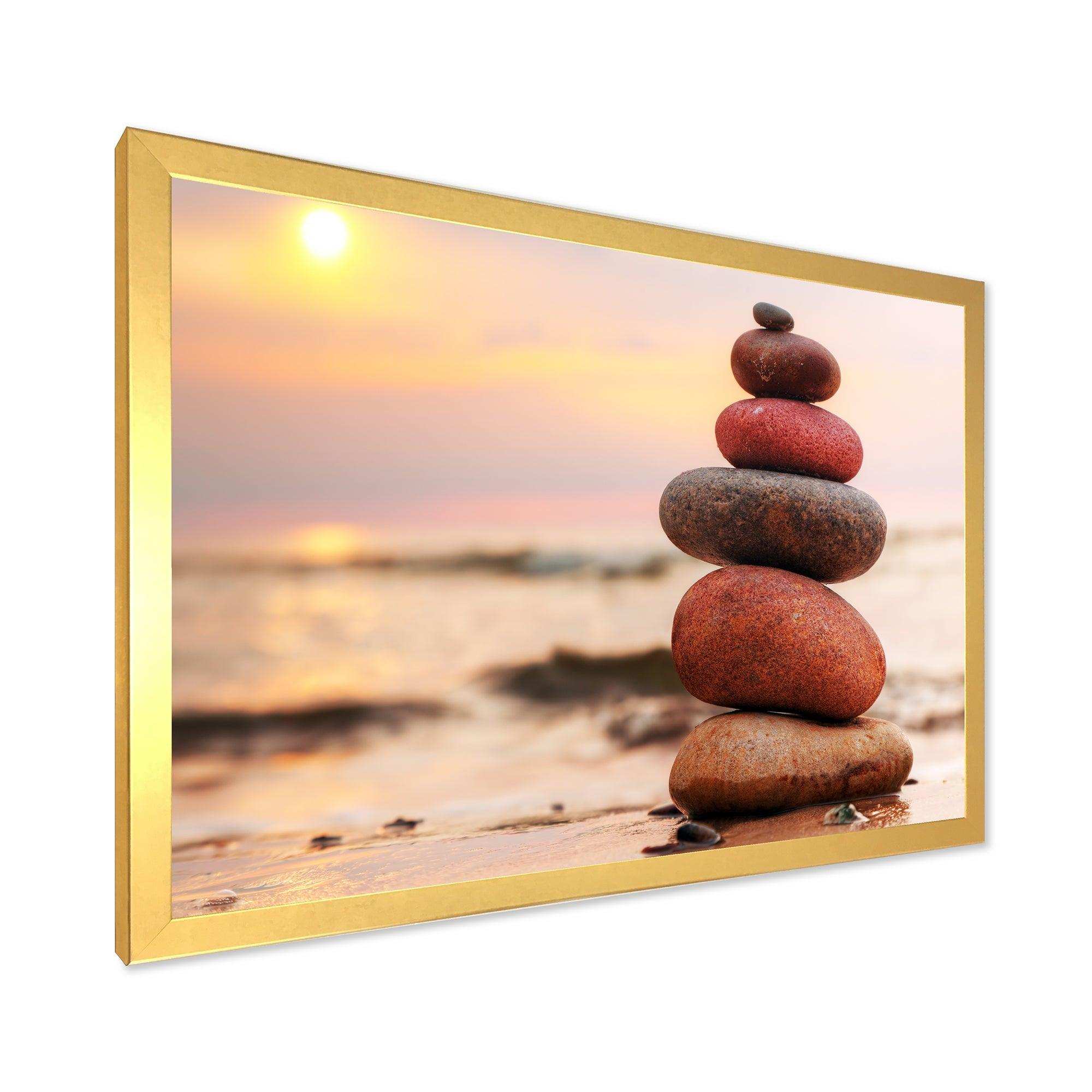 Stones Pyramid on Sand Symbolizing Zen
