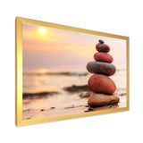 Stones Pyramid on Sand Symbolizing Zen