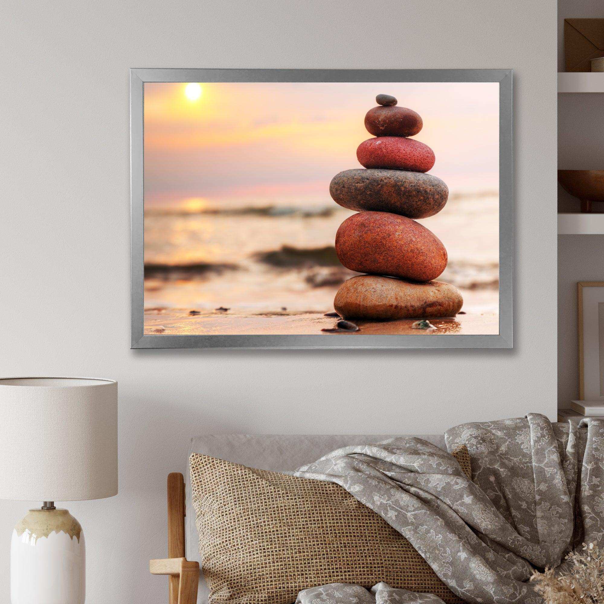 Stones Pyramid on Sand Symbolizing Zen