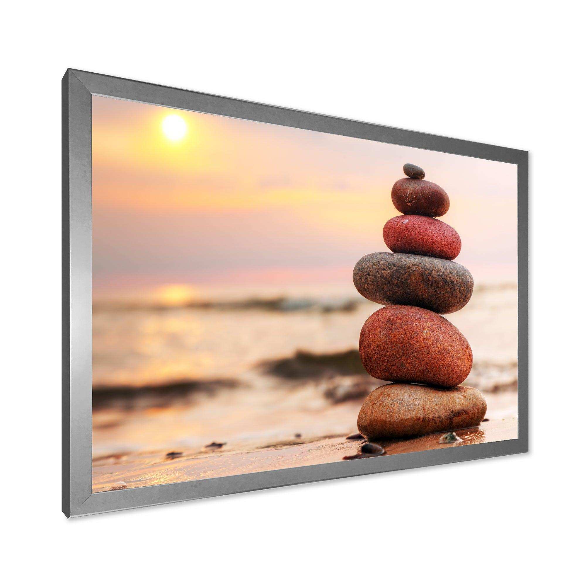 Stones Pyramid on Sand Symbolizing Zen