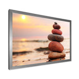 Stones Pyramid on Sand Symbolizing Zen