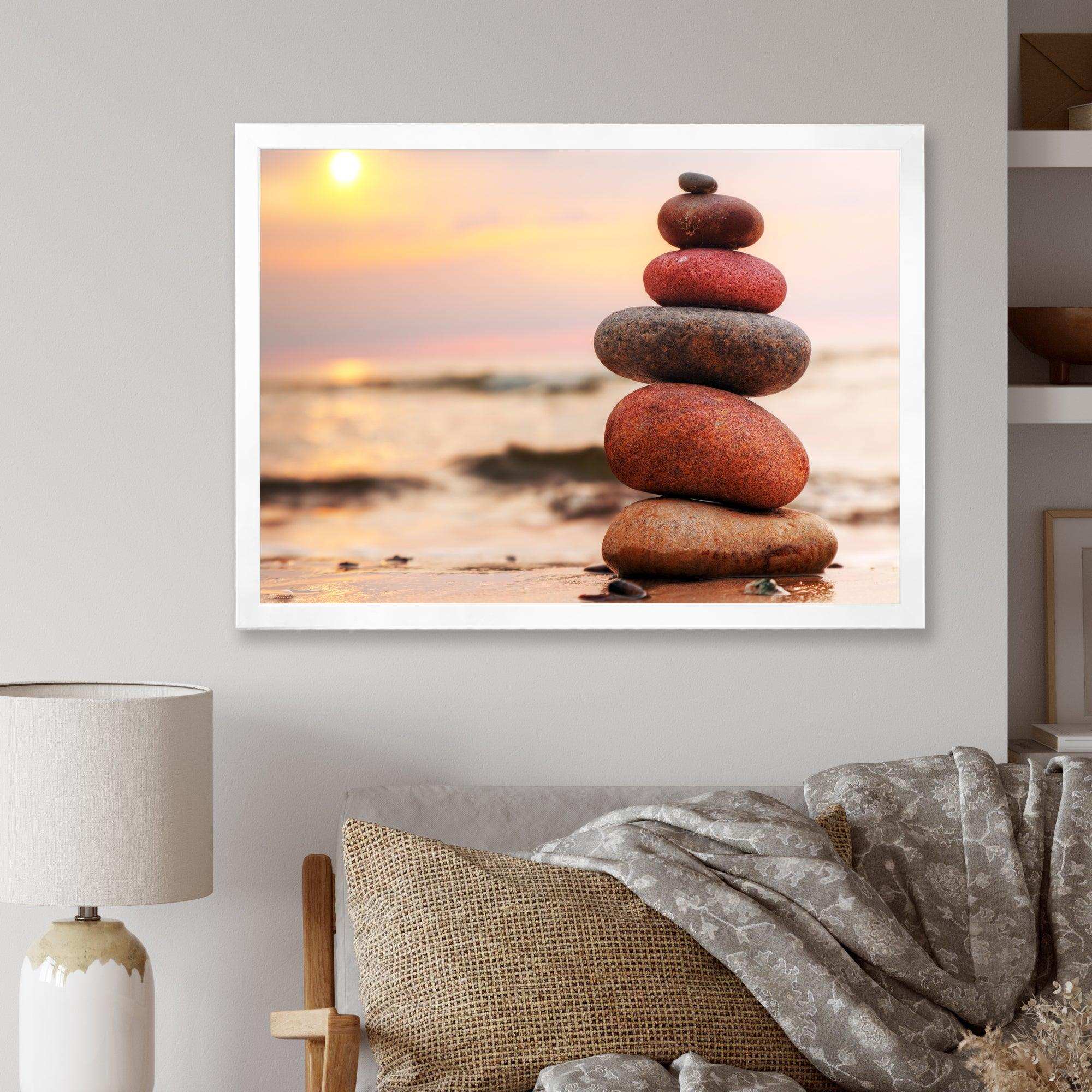 Stones Pyramid on Sand Symbolizing Zen