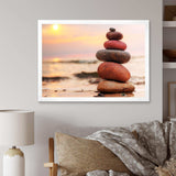 Stones Pyramid on Sand Symbolizing Zen