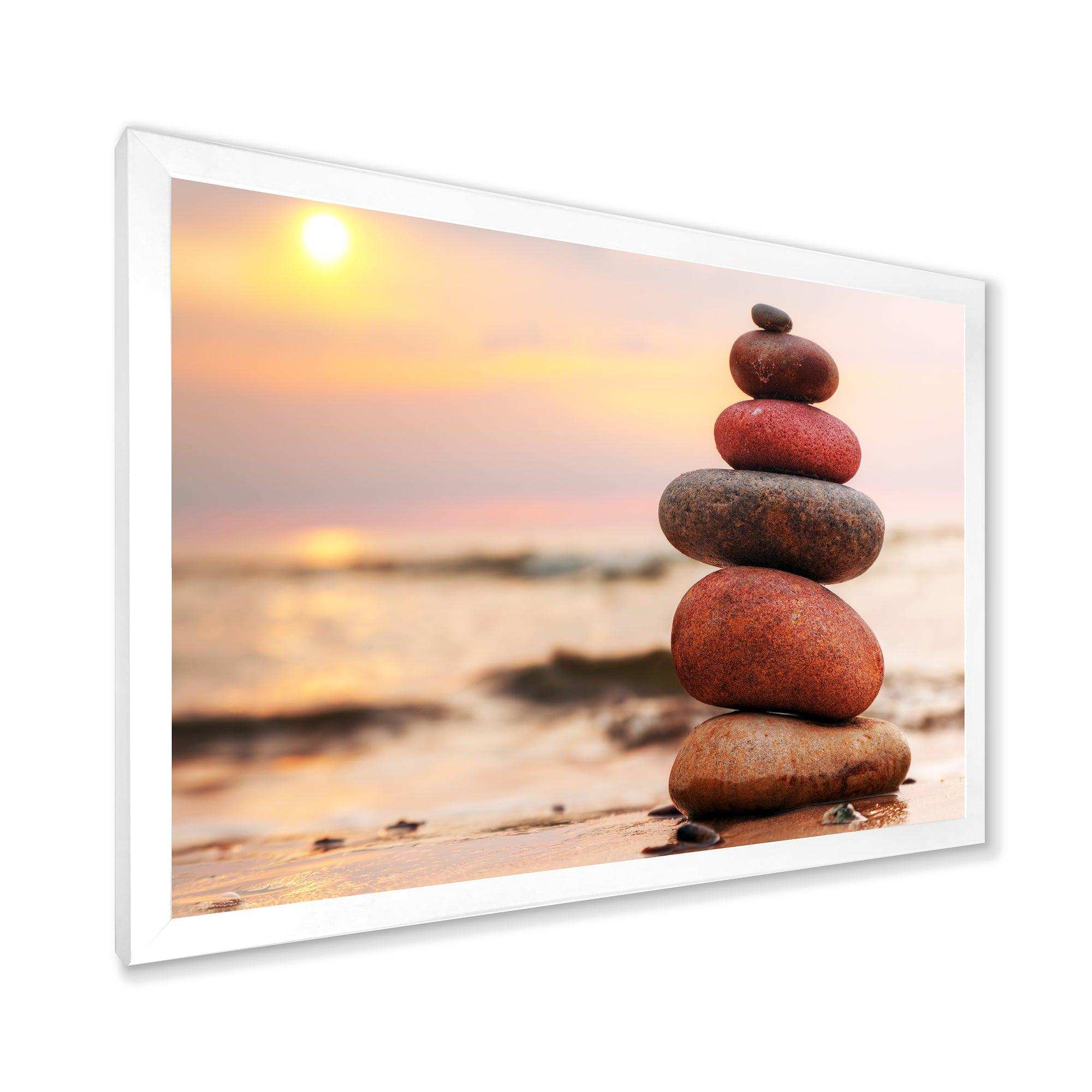 Stones Pyramid on Sand Symbolizing Zen