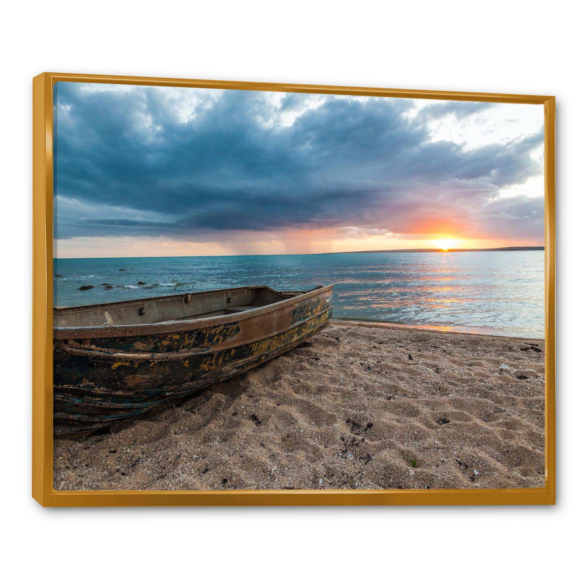 Rusty Row Boat on Sand at Sunset