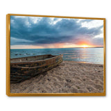 Rusty Row Boat on Sand at Sunset