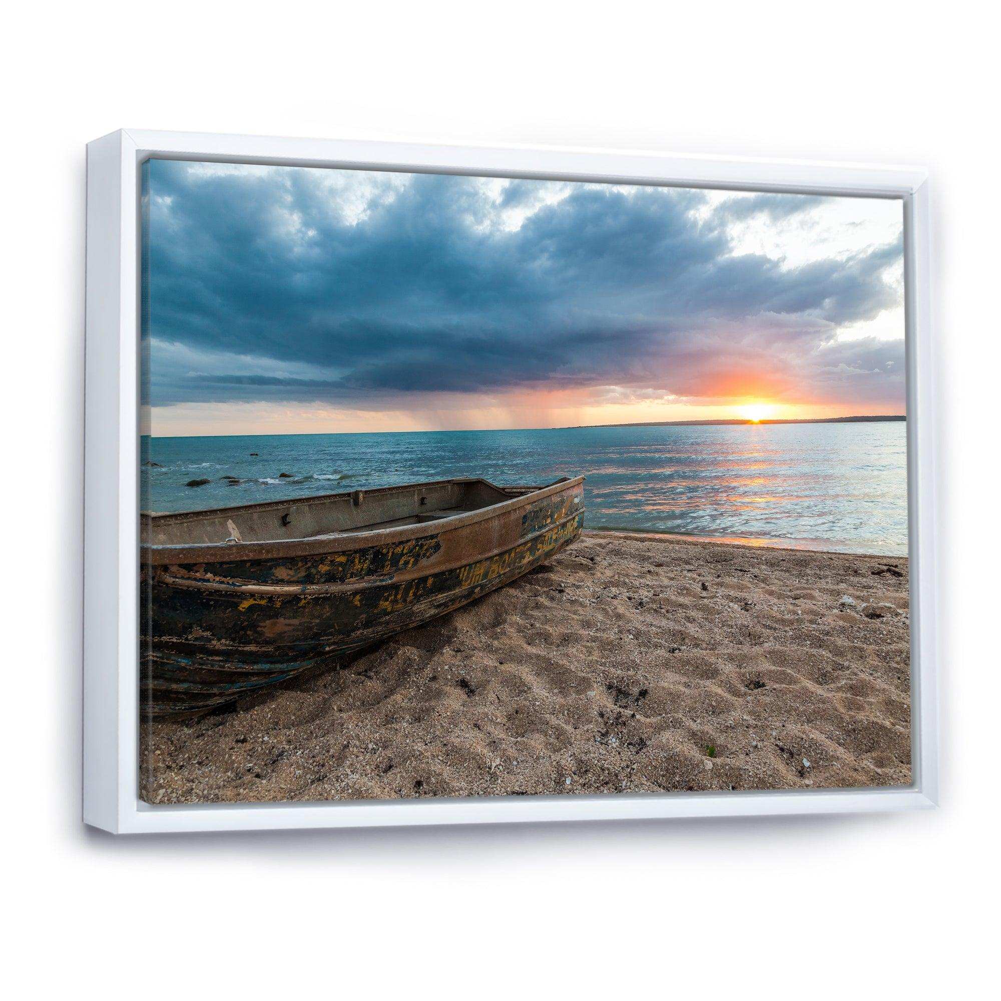 Rusty Row Boat on Sand at Sunset