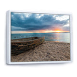 Rusty Row Boat on Sand at Sunset