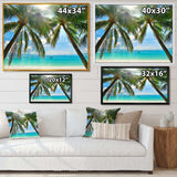 Palm Hanging over Sandy White Beach
