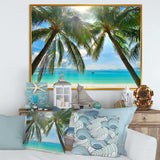 Palm Hanging over Sandy White Beach