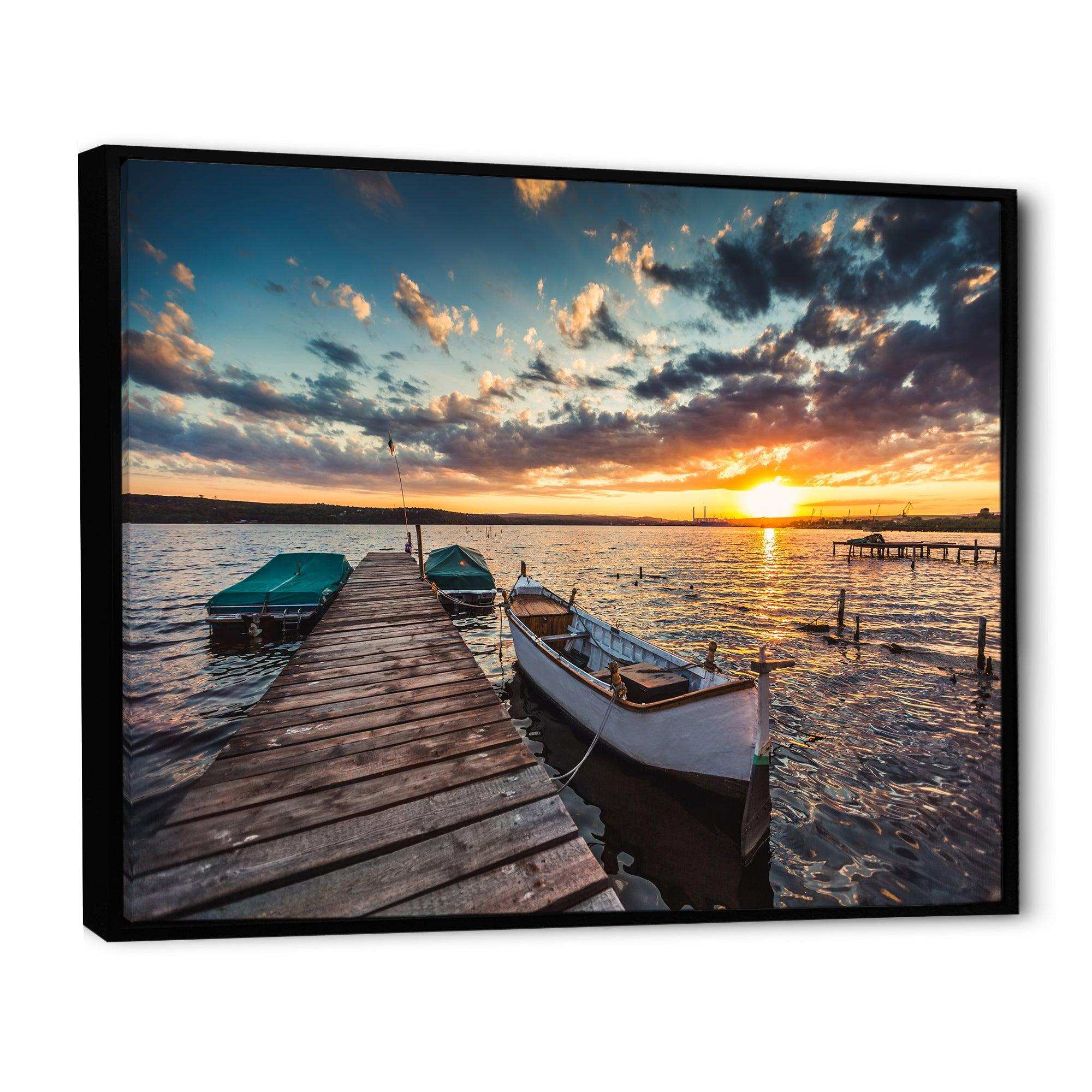 Boats and Jetty under Dramatic Sky