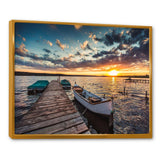 Boats and Jetty under Dramatic Sky