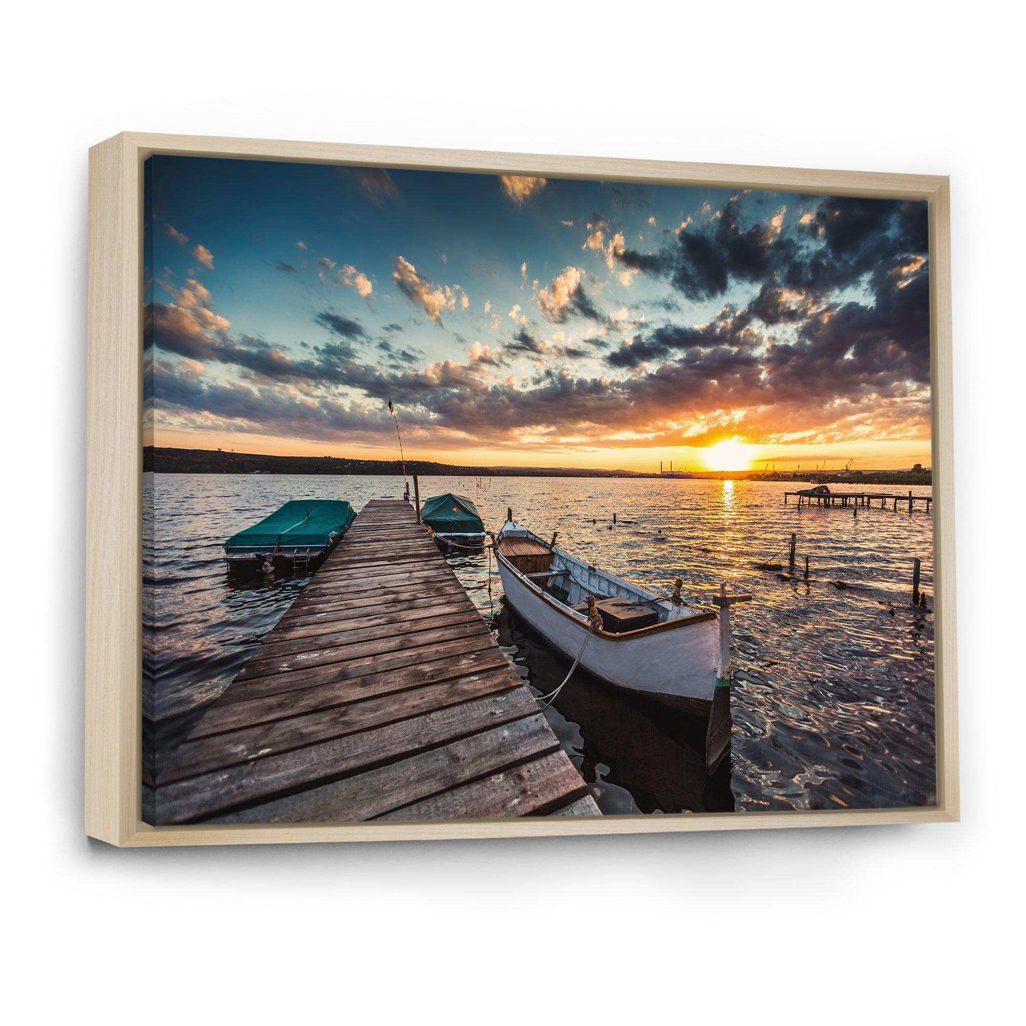 Boats and Jetty under Dramatic Sky