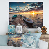Boats and Jetty under Dramatic Sky