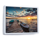 Boats and Jetty under Dramatic Sky