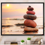 Stones Pyramid on Sand Symbolizing Zen