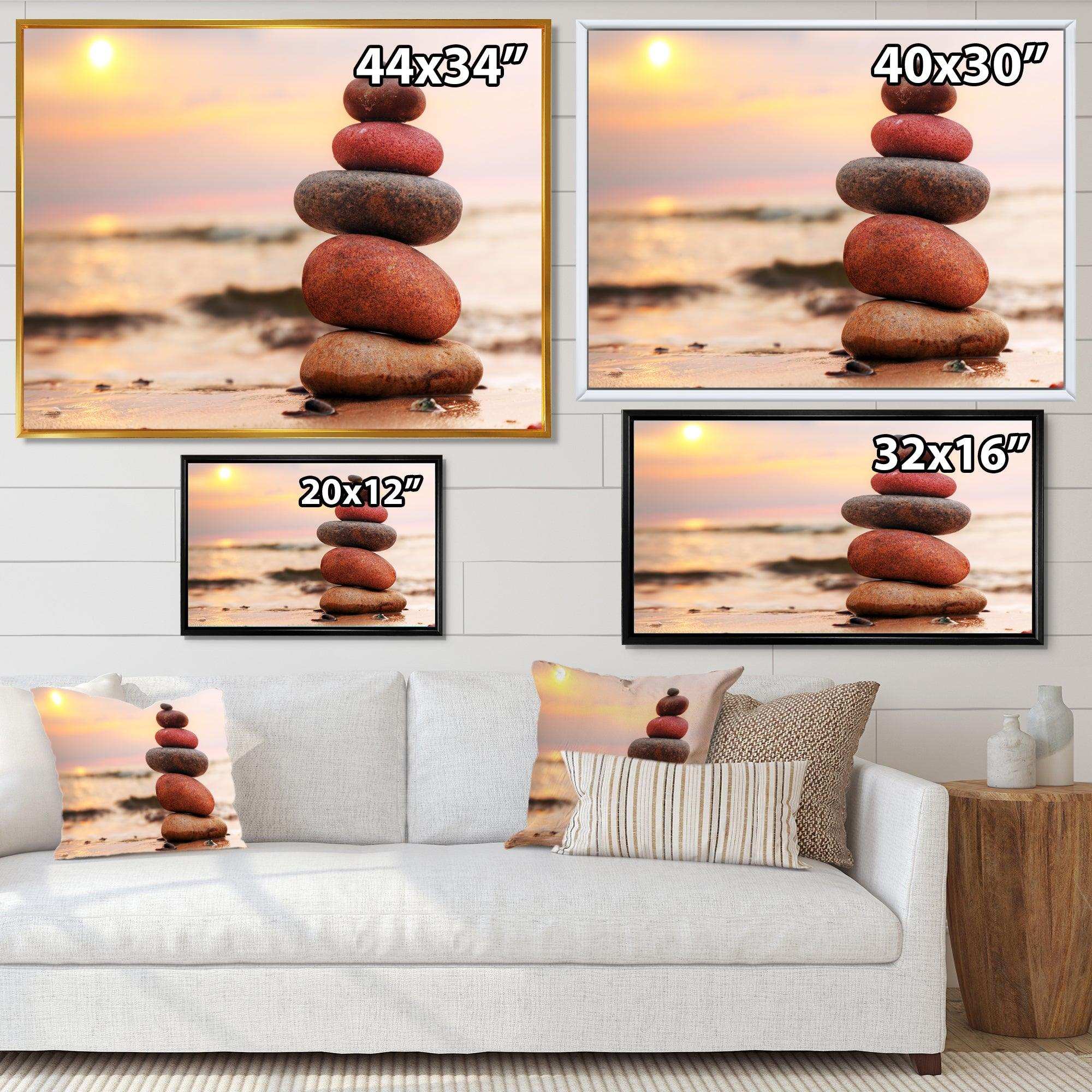 Stones Pyramid on Sand Symbolizing Zen