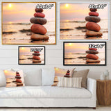 Stones Pyramid on Sand Symbolizing Zen