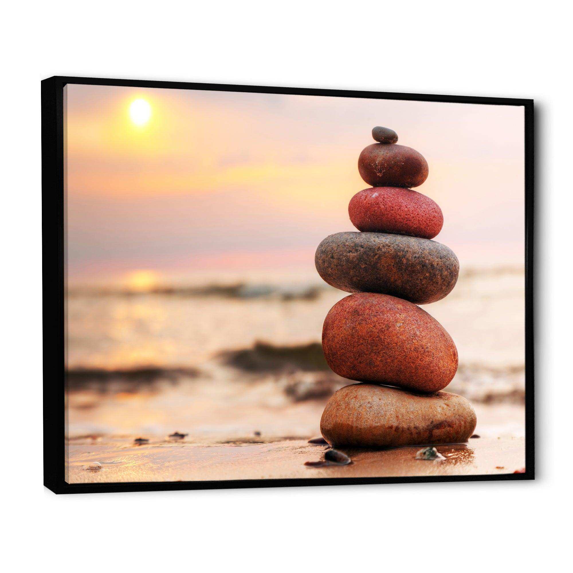 Stones Pyramid on Sand Symbolizing Zen