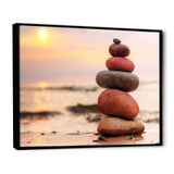 Stones Pyramid on Sand Symbolizing Zen