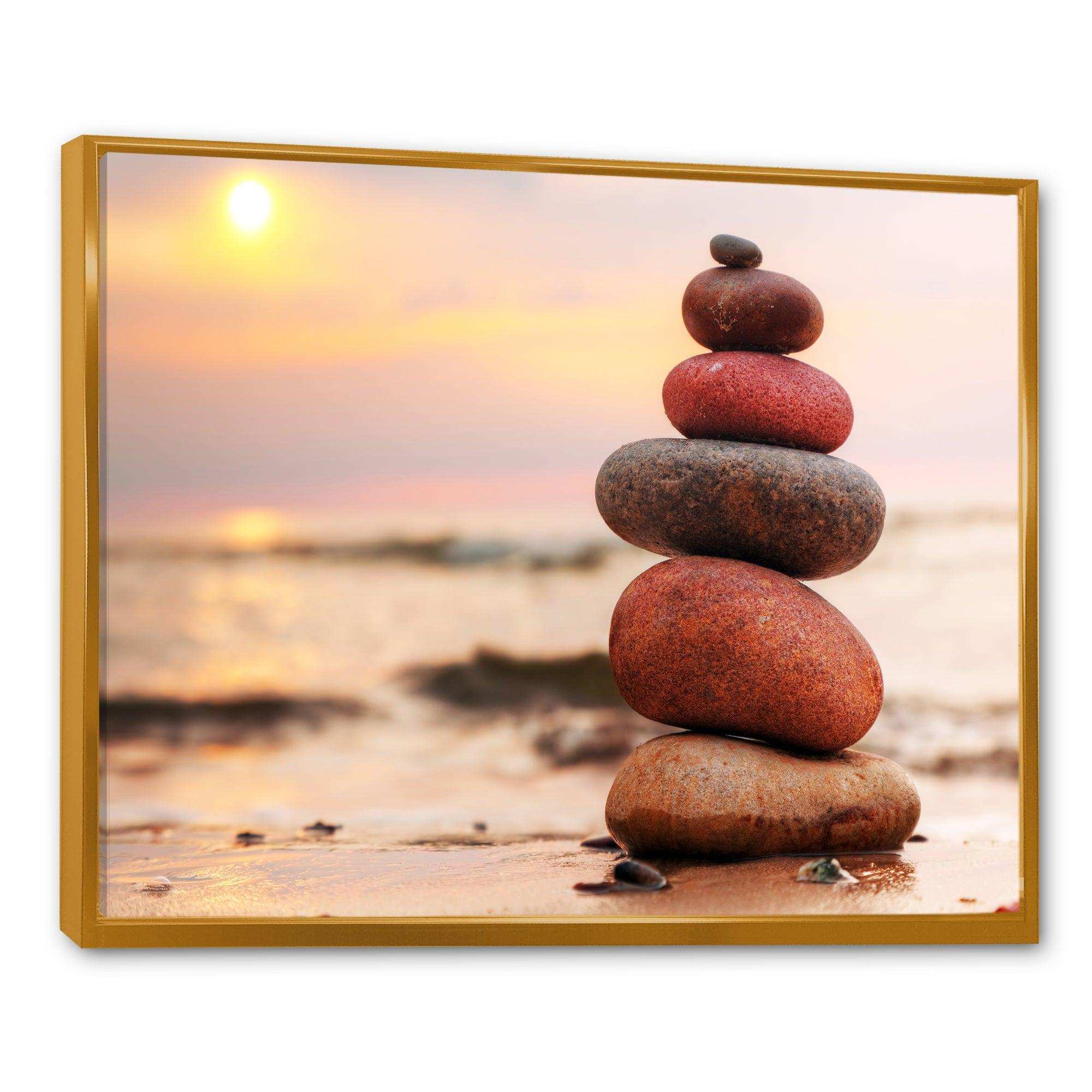 Stones Pyramid on Sand Symbolizing Zen