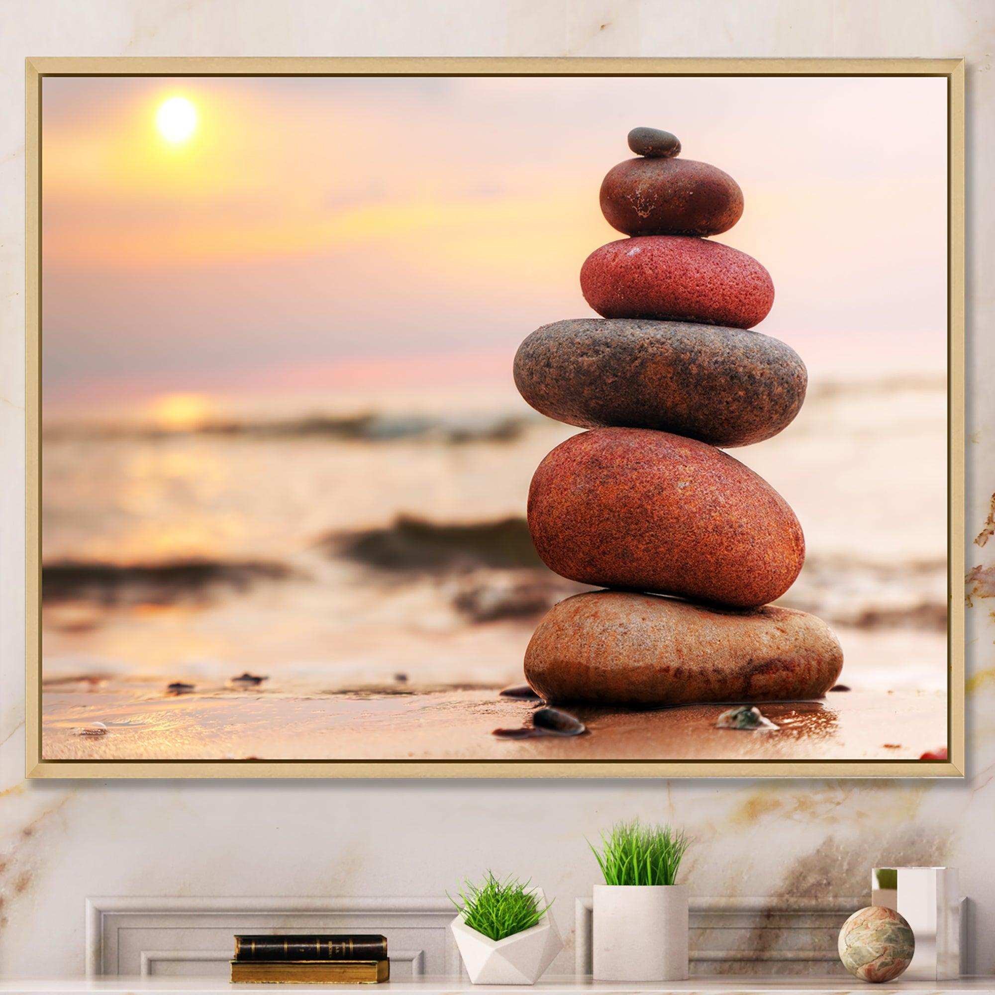Stones Pyramid on Sand Symbolizing Zen