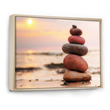 Stones Pyramid on Sand Symbolizing Zen