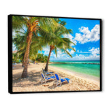 Blue chairs at the tropical white sand beach