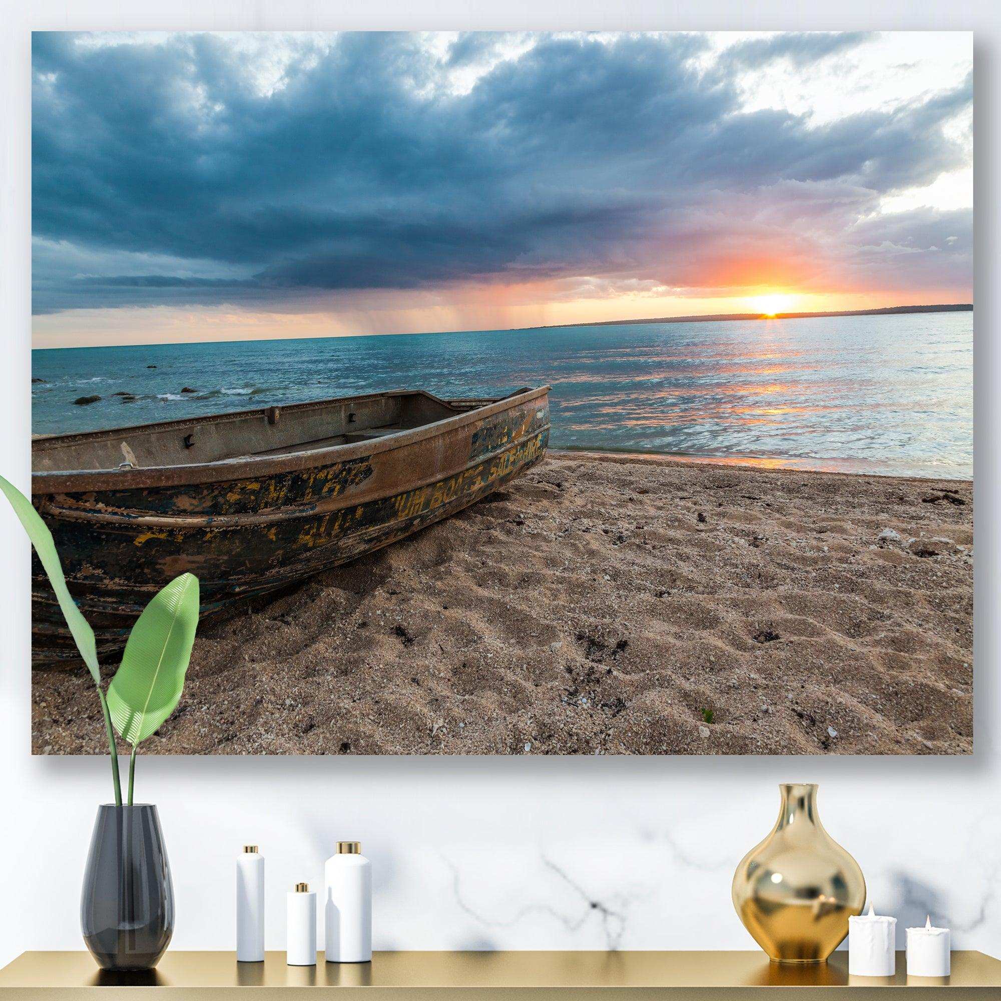 Rusty Row Boat on Sand at Sunset