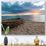 Rusty Row Boat on Sand at Sunset