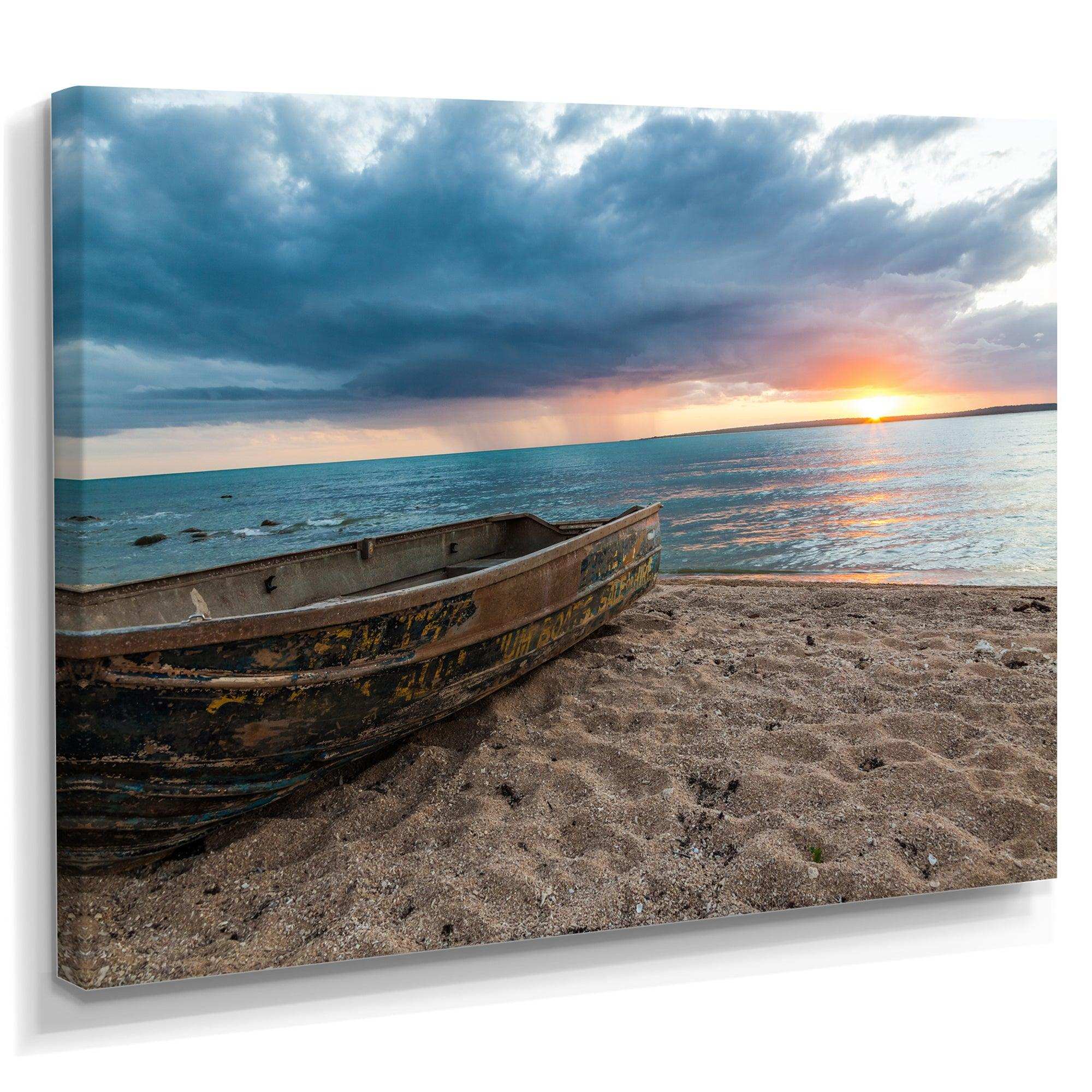 Rusty Row Boat on Sand at Sunset