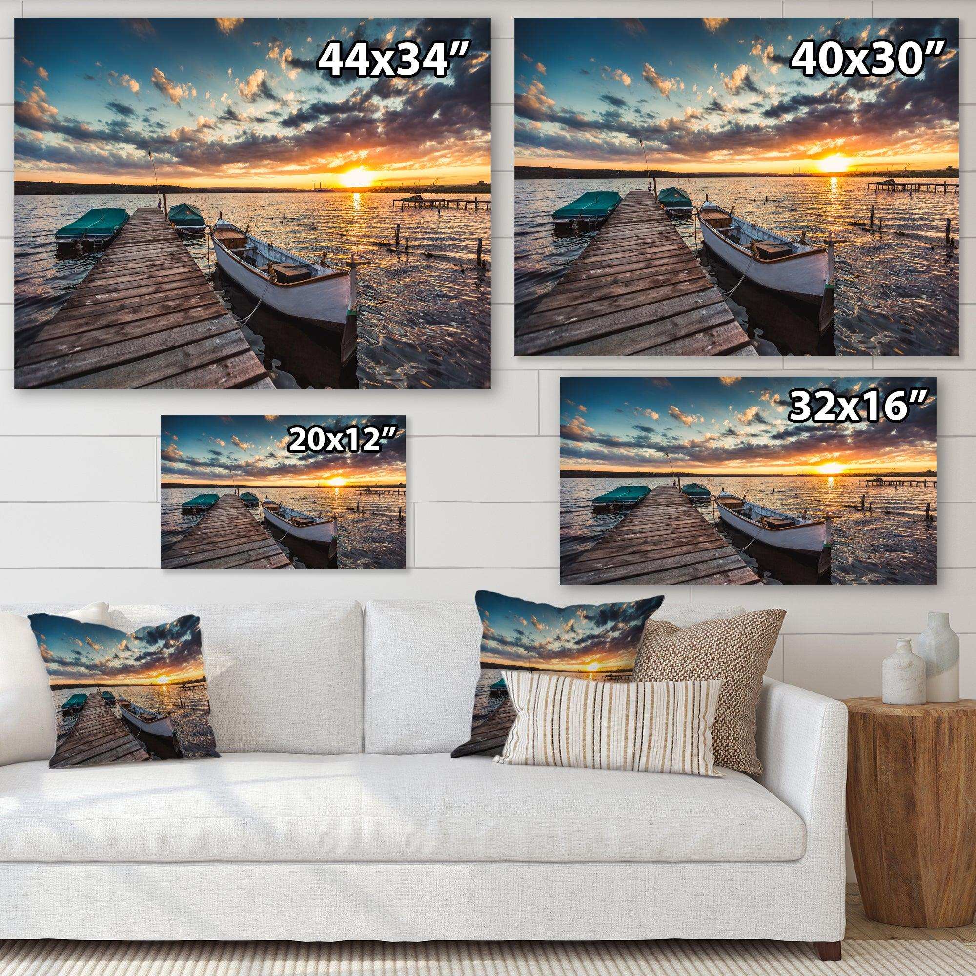 Boats and Jetty under Dramatic Sky