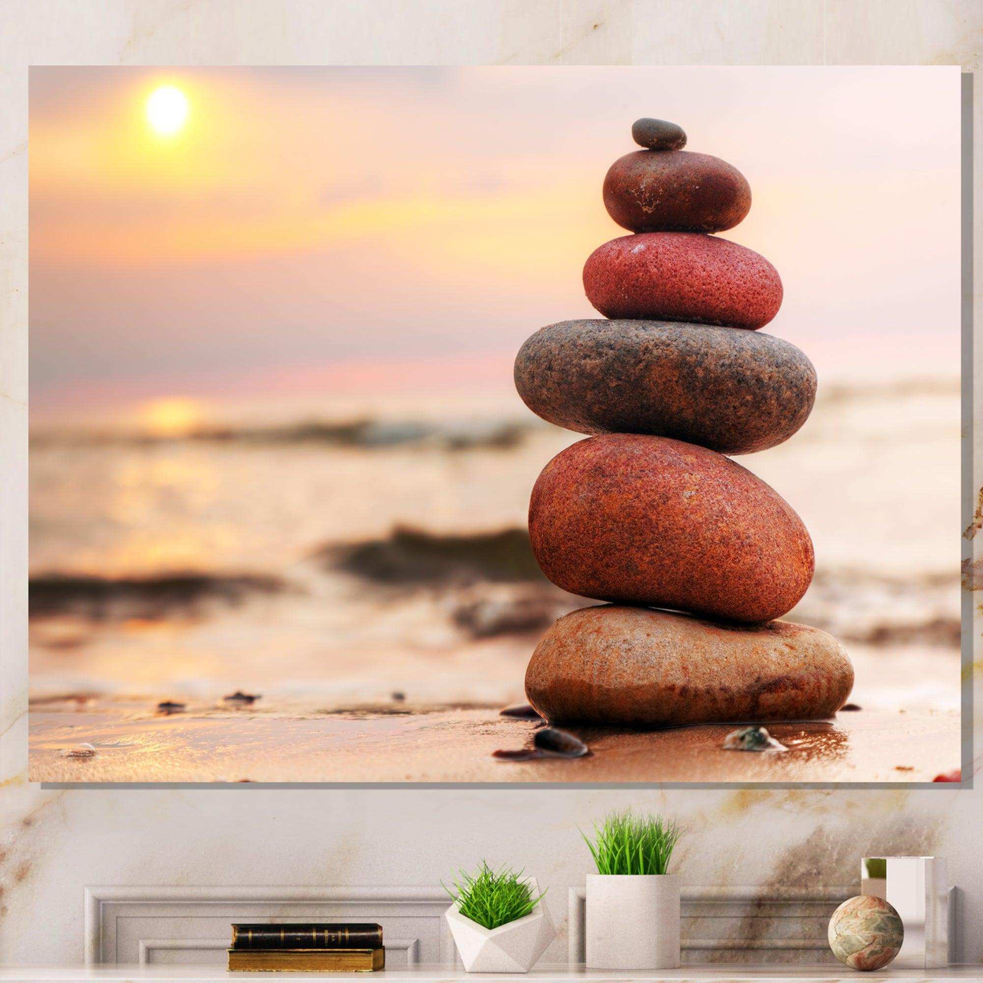 Stones Pyramid on Sand Symbolizing Zen