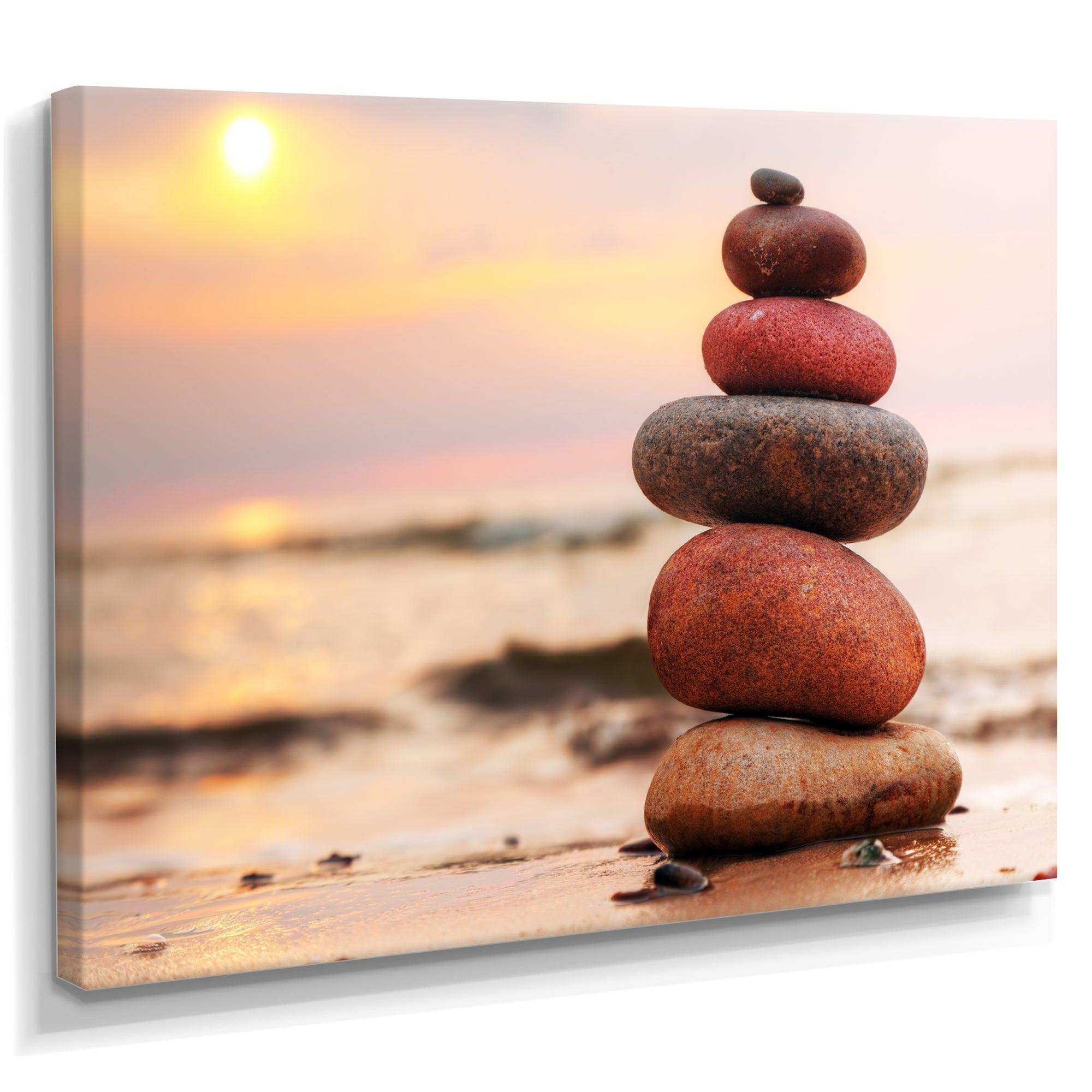 Stones Pyramid on Sand Symbolizing Zen