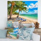 Blue chairs at the tropical white sand beach