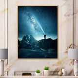 A Man Shining A Light Into The Night Sky