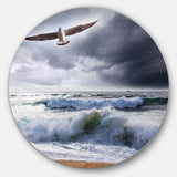 Large Seagull over Stormy Waves' Beach Metal Circle Wall Art