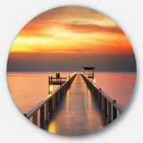 Yellowish Sky and Long Wooden Bridge' Pier Seascape Metal Circle Wall Art