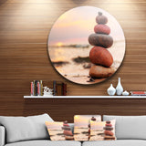 Stones Pyramid on Sand Symbolizing Zen' Landscape Metal Circle Wall Art